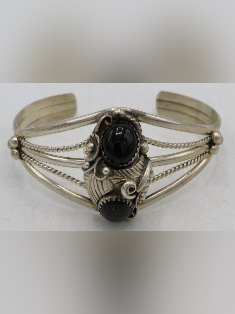 Fred James vintage Navajo sterling silver cuff bracelet two black onyx cabochons